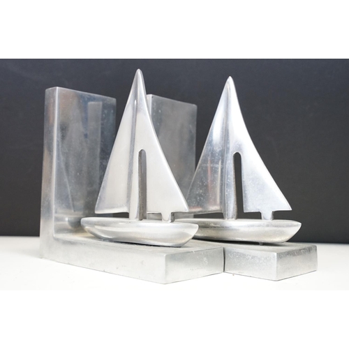 113 - Pair of aluminium nautical bookends in the form of sailing boats, approx 16cm high