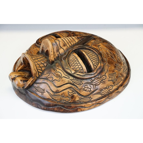 116 - Large carved wood tribal mask, 40cm high