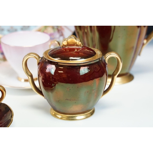 121 - Carlton Ware 'Rouge Royale' coffee set comprising coffee pot, sugar basin, 6 cups and 7 saucers, tog... 