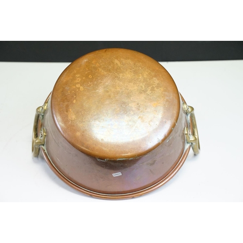 125A - Late 19th / early 20th C heavy copper jam pan with brass riveted handles, 51cm diameter, 12.5cm dept... 