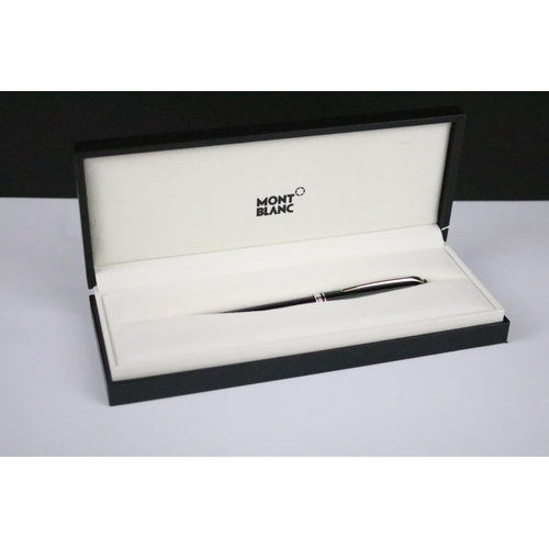 137 - A Montblanc Cruise black ball point pen, complete with instruction book, case and outer box.