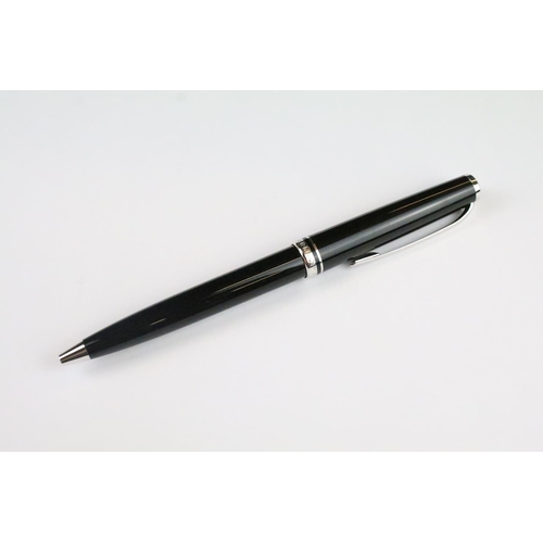 137 - A Montblanc Cruise black ball point pen, complete with instruction book, case and outer box.