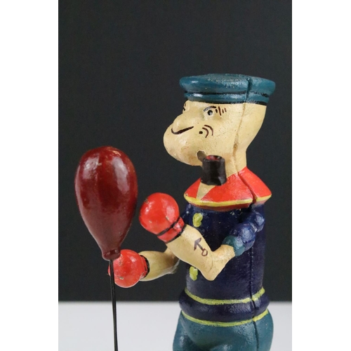 142 - A reproduction cast iron Popeye mechanical boxing toy.