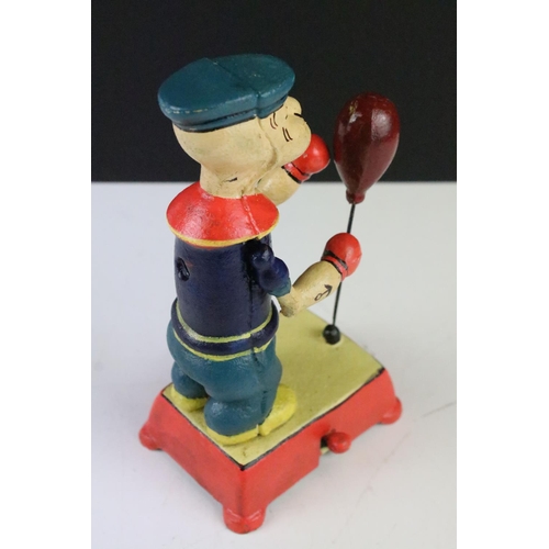 142 - A reproduction cast iron Popeye mechanical boxing toy.