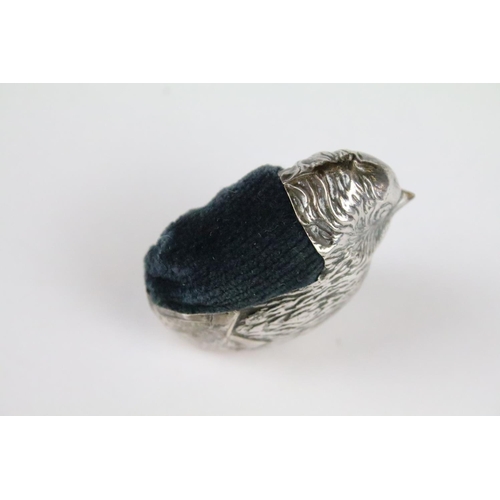 143 - A fully hallmarked sterling silver pin cushion in the form of chick, blue velvet cushion, maker mark... 