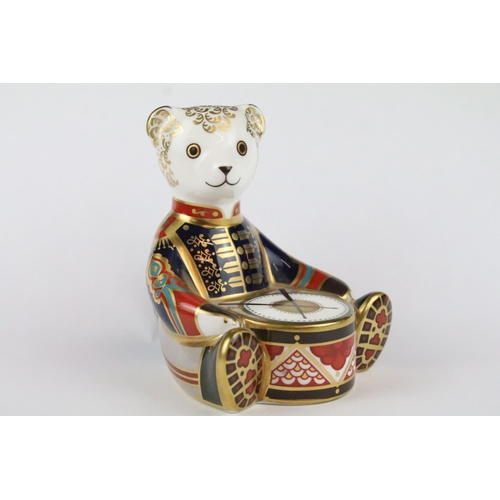 147 - Two Royal Crown Derby paperweights to include Bow Tie Bear and Drummer Bear, with gold stoppers