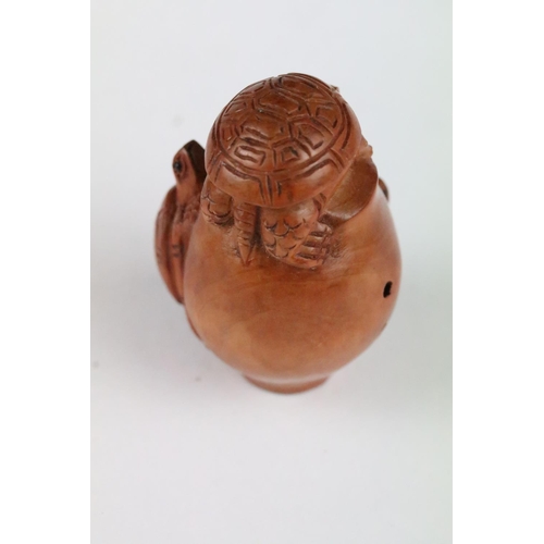 152 - Two signed carved wood netsuke figures to included a Monkey with nut and Turtles, 5cm approx