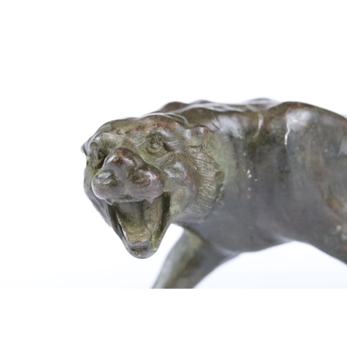 153 - An ornamental Chinese bronze tiger, measures approx 13cm in length.