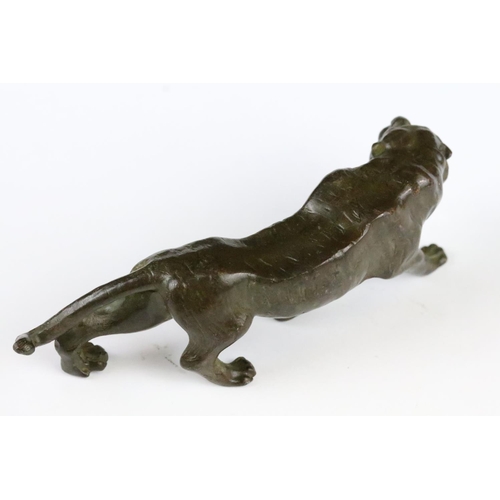 153 - An ornamental Chinese bronze tiger, measures approx 13cm in length.