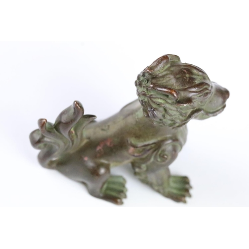 159 - A Chinese ornamental bronze dog of foo statue