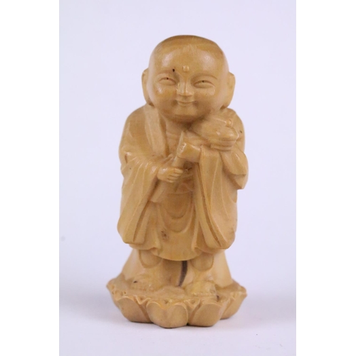 165 - Two carved wooden netsuke figure to include a Little Monk and an Old Man with offering, 6cm approx