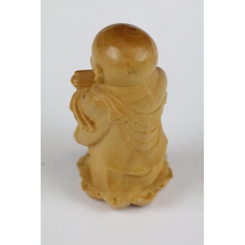 165 - Two carved wooden netsuke figure to include a Little Monk and an Old Man with offering, 6cm approx