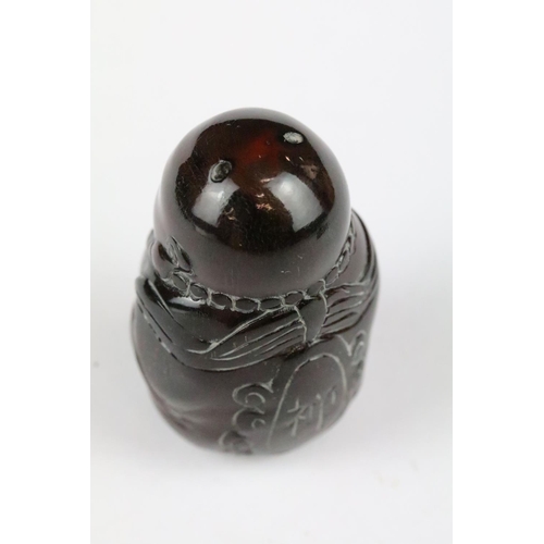 168 - Three carved netsuke toggles to include a Happy Buddha, Koi Fish and Buddha head, largest measures 7... 