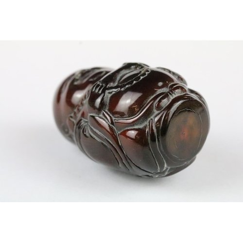 168 - Three carved netsuke toggles to include a Happy Buddha, Koi Fish and Buddha head, largest measures 7... 