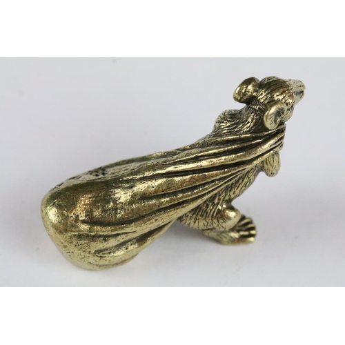 173 - A Chinese brass ornamental lucky rat figure with money bag, character marks to bag