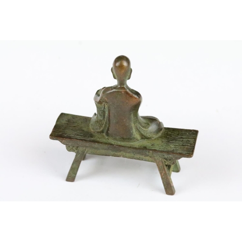 178 - A Chinese bronze of a seated Buddha, approx 8cm in height.