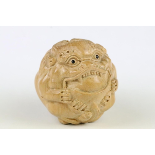 179 - Two carved wooden netsuke figures in the form of dragons, 5cm approx