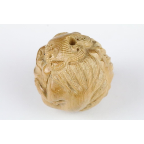 179 - Two carved wooden netsuke figures in the form of dragons, 5cm approx