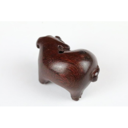 181 - Three carved wooden miniature netsuke figures to include signed Pig, Money Goat and a Dragon