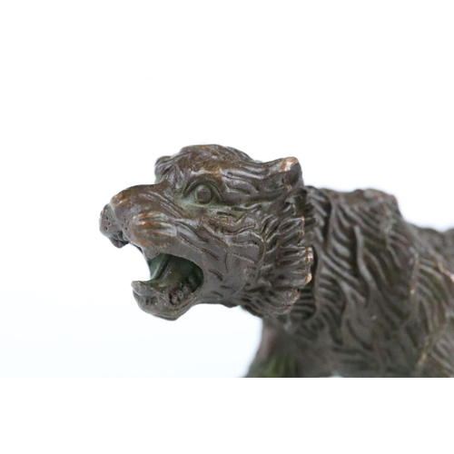 188 - A Chinese bronze ornament in the form of a tiger.