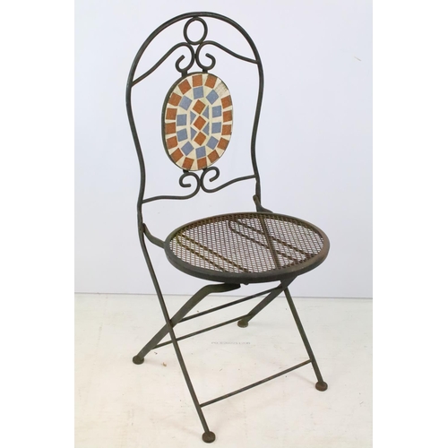 201 - A rustic wrought iron garden chair with mesh seat together with a glass topped table.