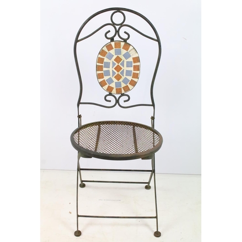 201 - A rustic wrought iron garden chair with mesh seat together with a glass topped table.