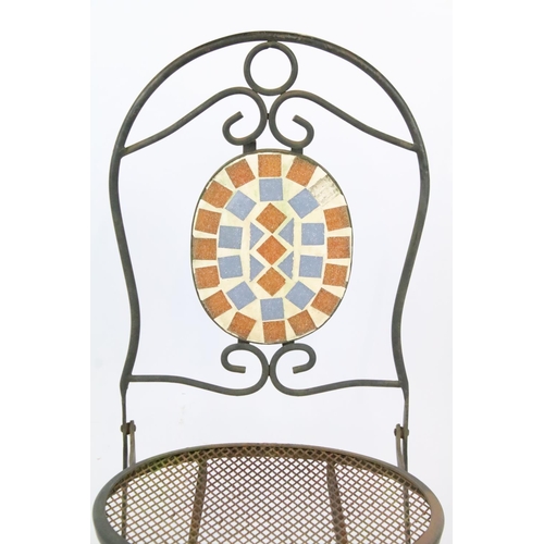 201 - A rustic wrought iron garden chair with mesh seat together with a glass topped table.