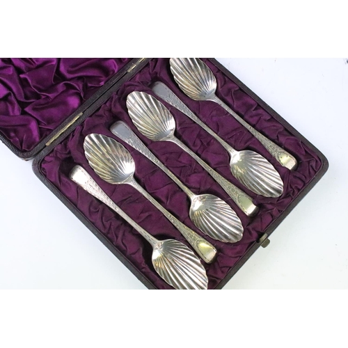 211 - A cased set of six fully hallmarked sterling silver spoons with scalloped bowls together with a silv... 