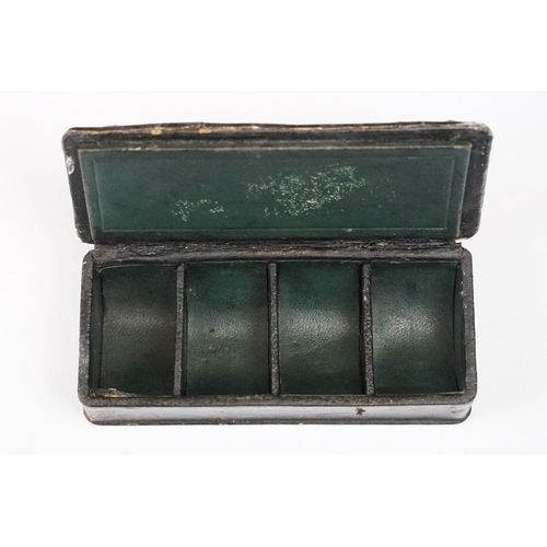 212 - An antique leather stamp box with four section sloped interior, silver repousse panel to top, maker ... 