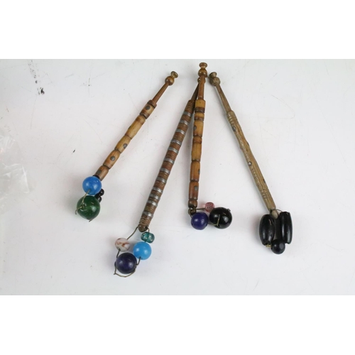 230 - Collection of antique lace bobbins to include bone and turned wooden examples, some decorated with b... 