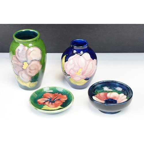 24 - Group of Moorcroft pottery, four pieces, to include a blue ground Magnolia pattern vase (approx 9cm ... 