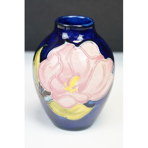 24 - Group of Moorcroft pottery, four pieces, to include a blue ground Magnolia pattern vase (approx 9cm ... 