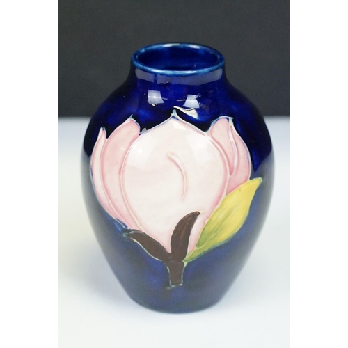 24 - Group of Moorcroft pottery, four pieces, to include a blue ground Magnolia pattern vase (approx 9cm ... 