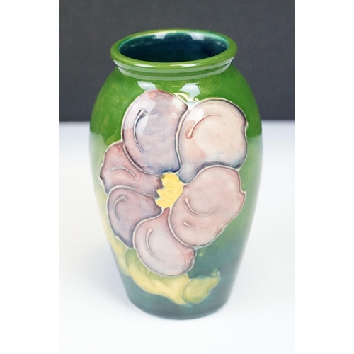 24 - Group of Moorcroft pottery, four pieces, to include a blue ground Magnolia pattern vase (approx 9cm ... 