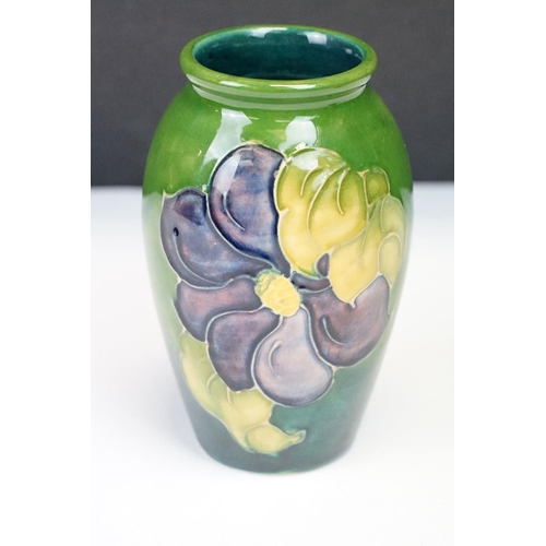 24 - Group of Moorcroft pottery, four pieces, to include a blue ground Magnolia pattern vase (approx 9cm ... 