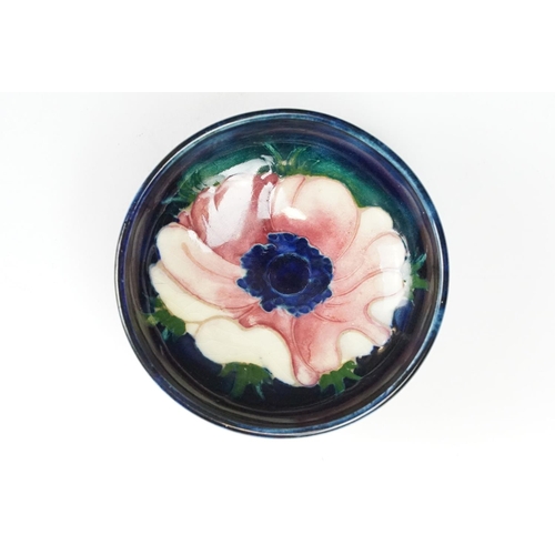 24 - Group of Moorcroft pottery, four pieces, to include a blue ground Magnolia pattern vase (approx 9cm ... 