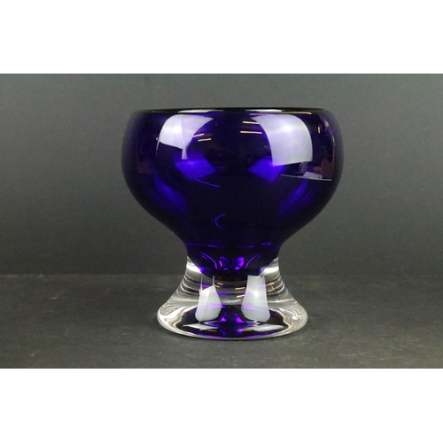 250 - Boxed Bedminster Bristol Blue glass vase raised on a clear glass foot, with label to base, approx 15... 