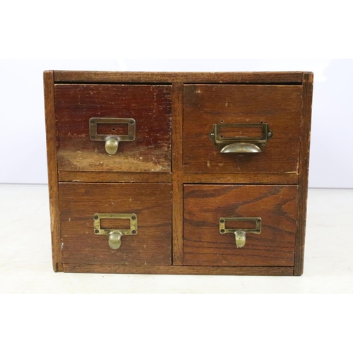 255 - Early 20th century oak chest of four small office drawers, 30.5cm high x 38cm wide x 49cm deep