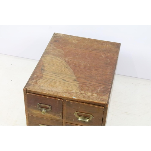 255 - Early 20th century oak chest of four small office drawers, 30.5cm high x 38cm wide x 49cm deep