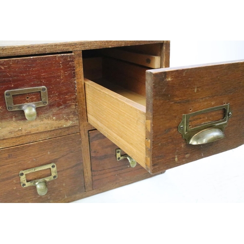 255 - Early 20th century oak chest of four small office drawers, 30.5cm high x 38cm wide x 49cm deep