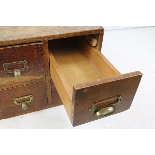 255 - Early 20th century oak chest of four small office drawers, 30.5cm high x 38cm wide x 49cm deep