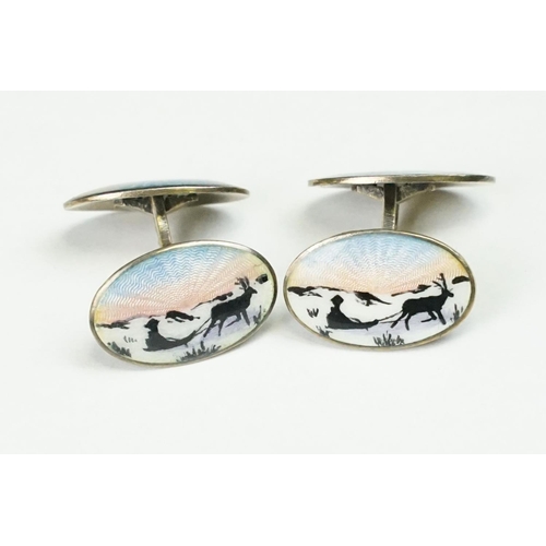 256 - A pair of scandinavian 925 sterling silver and enamel cufflinks, four enamel panels with stag and sl... 