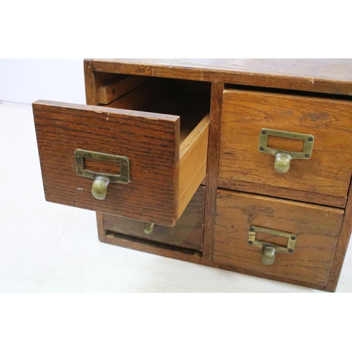 258 - Early 20th century oak chest of four small office drawers, 30.5cm high x 38cm wide x 49cm deep