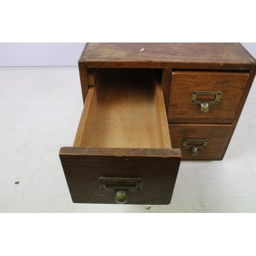 258 - Early 20th century oak chest of four small office drawers, 30.5cm high x 38cm wide x 49cm deep