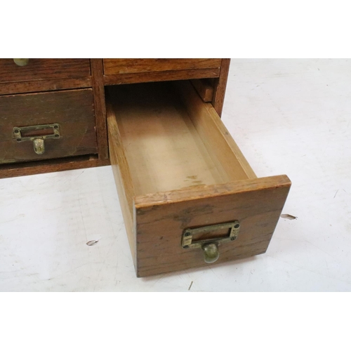 258 - Early 20th century oak chest of four small office drawers, 30.5cm high x 38cm wide x 49cm deep