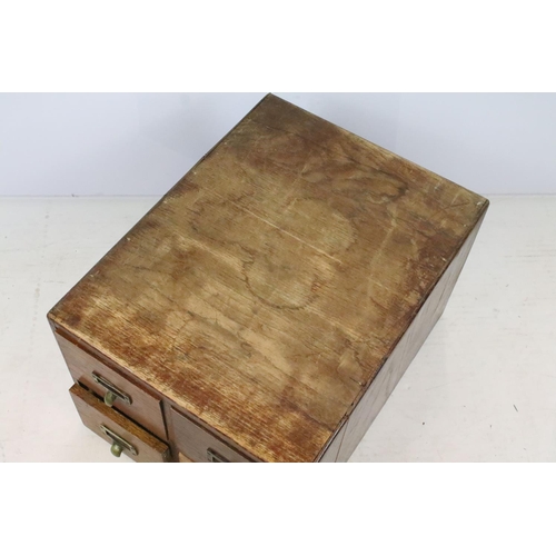 259 - Early 20th century oak chest of four small office drawers, 30.5cm high x 38cm wide x 49cm deep