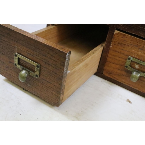 259 - Early 20th century oak chest of four small office drawers, 30.5cm high x 38cm wide x 49cm deep