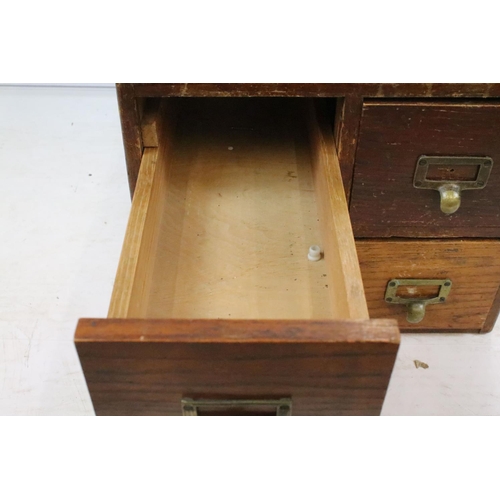 259 - Early 20th century oak chest of four small office drawers, 30.5cm high x 38cm wide x 49cm deep