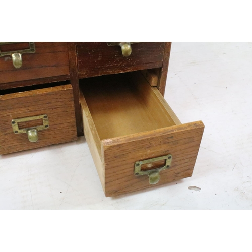 259 - Early 20th century oak chest of four small office drawers, 30.5cm high x 38cm wide x 49cm deep