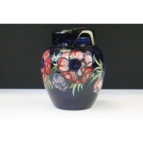 26 - Two Moorcroft pottery blue ground floral ginger jars to include a Hibiscus pattern and Anemone patte... 